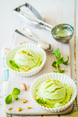 Pistachio ice cream in white bowl