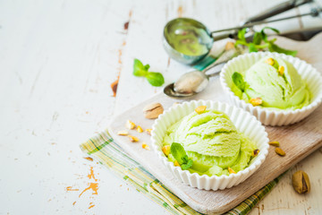 Pistachio ice cream in white bowl