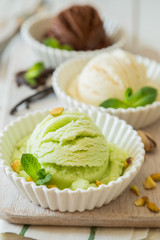 Selection of colorful ice cream scoops in white bowls