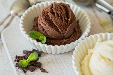 Selection of colorful ice cream scoops in white bowls
