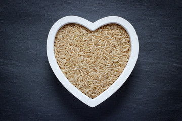 Heart shaped bowl filled with brown rice