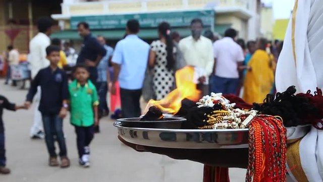 Shot of priest holding religious thali, Chamundeshwari Temple, Mysore, Karnataka, India