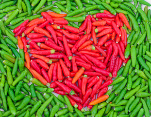 Heart form chillies background - Love concept