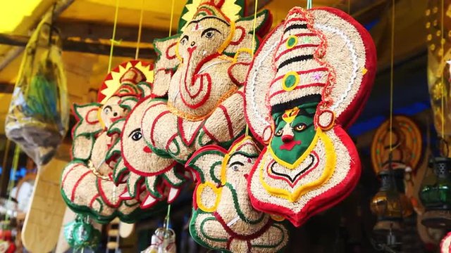 Locked-on shot of painted masks on display, Munnar, Idukki District, Kerala, India