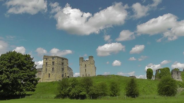 Wide angle view of Helmsley castle with cloudy sky