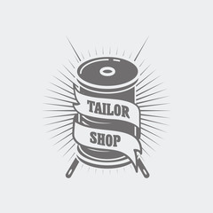 Vector logo or label template for tailor shop and sewing. Two needles and spool of thread
