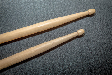 Wood Drumsticks in black texture background