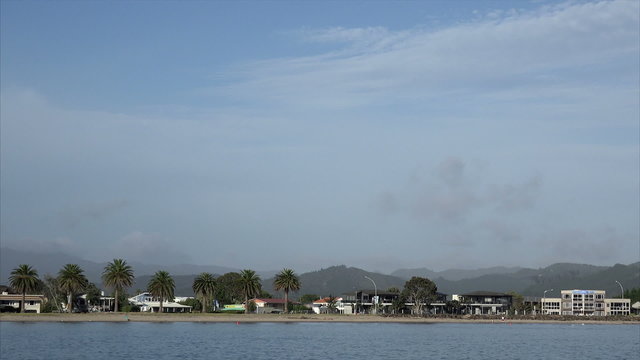 tracking shot of houses Whitianga waterfront, Coromandel Peninsular, New Zealand