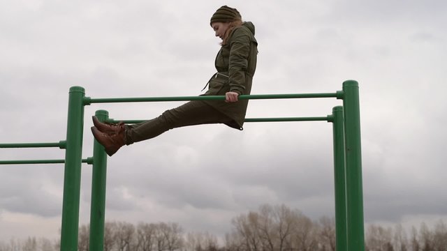 Woman training outdoors. Shot from hands