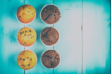 Retro Homemade Chocolate Chip Muffins On Blue Table