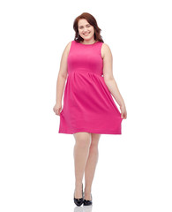 happy young plus size woman posing in pink dress