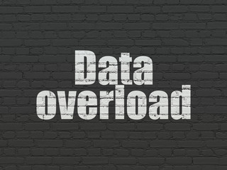 Information concept: Data Overload on wall background