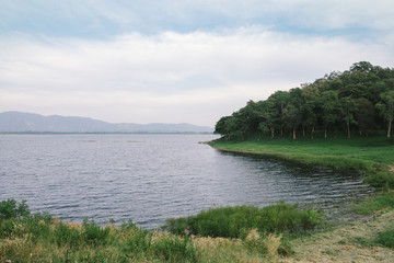 Peaceful lake in cloudy day