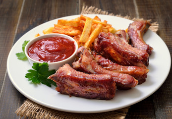 Pork ribs and tomato sauce on white plate © nadin333