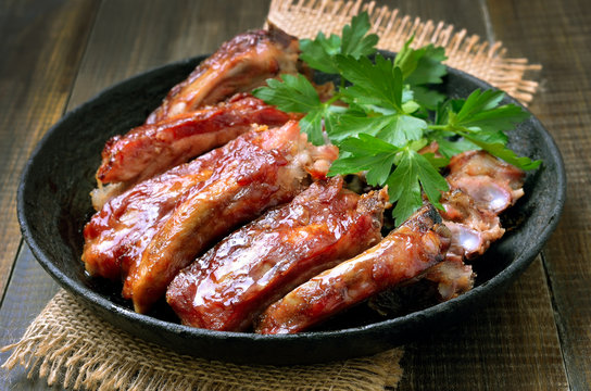 Roasted pork ribs in frying pan