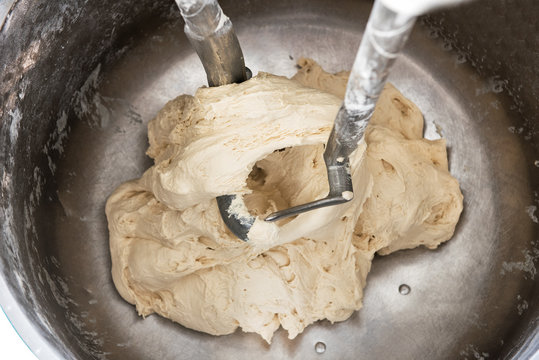 Dough In Industrial Bakery Mixer With Dough Hooks