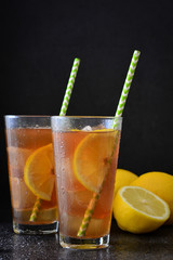 Ice tea with lemon. Black stone
