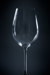 contour silhouette of wineglass on grey blue background