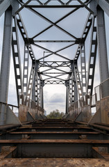 Old abandoned riveted railroad bridge
