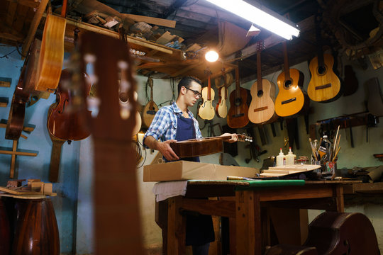 Artisan Lute Maker Storing Guitar Music Instrument In Case
