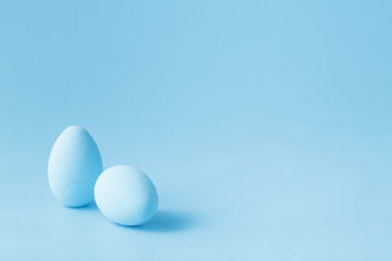 Colored easter eggs on blue background