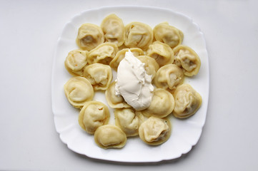 Boiled prepared homemade russian dumplings or pelmeni