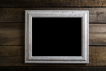 Vintage frames on wooden background with space for text