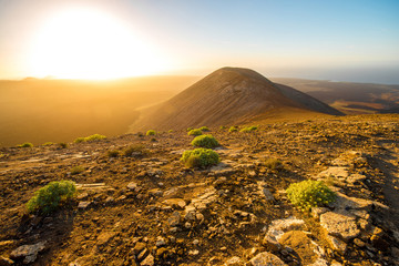 Volcanic landscape view from the top of Caldera Blanca volcano on the sunset on Lanzarote island in...