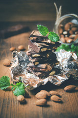Dark chocolate with nuts, mint leaves, almonds