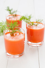 Carrot juice in three glasses