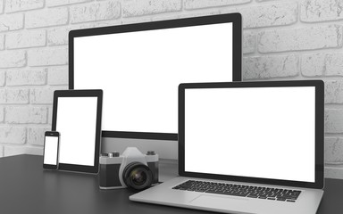 Fototapeta premium Responsive mockup screen. Monitor, laptop, tablet, phone on table in office. 3D rendering.