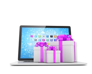 Gift box with ribbon bow on laptop keyboard. 3D rendering.
