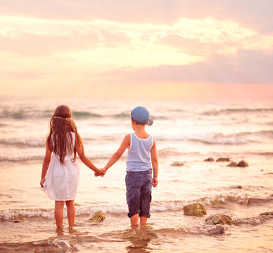 Two Kids Watching Sunset.