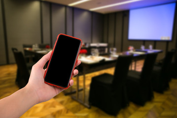 moblie phone on hand with nature background