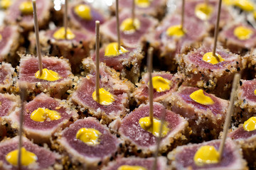 Seared tuna steak garnished with spicy mustard still life