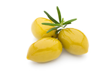 Olives on leaves isolated on white.