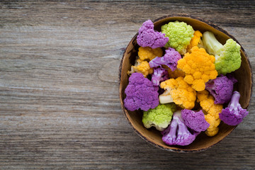 Cauliflower. Rainbow of eco on the wooden table.