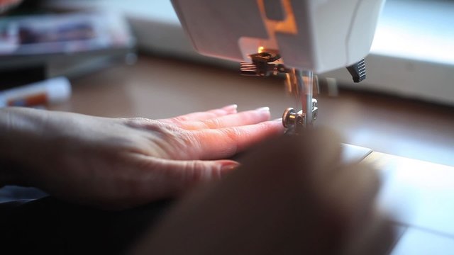 Woman sewing with a sewing machine