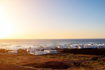 Cityscape view on El Golfo village with white houses on Lanzarote island in Spain