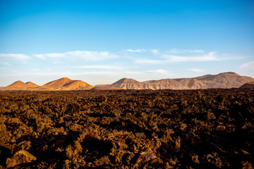 Volcanic landscape near Los Hervideros capes on Lanzarote island in Spain
