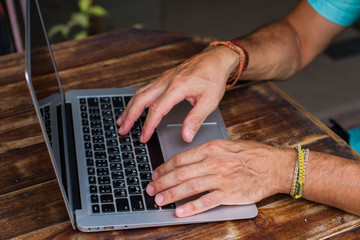 The man's hands working for noubuky the business plan, the keyboard