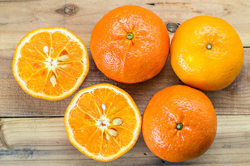 Fresh orange on wooden table