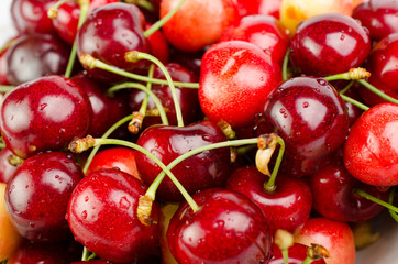 Cherry with leaves isolated on white