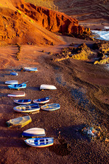 El Golfo bay with fishing boats on the sunset on Lanzarote island in Spain
