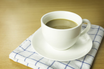 Concept of coffee break. cup of coffee on wooden desk