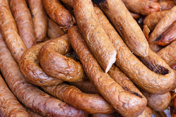 Homemade fresh meat delicacies (sausages) at a farmers' Sunday market.