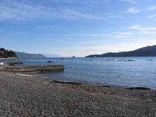 Landscape of Golfo Dei Poeti with its mussel farm in the sea. Province of La Spezia, Italy