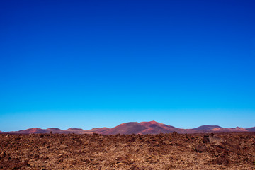 Volcanic landscape on Lanzarote island in Spain. Wide angle view with copy space