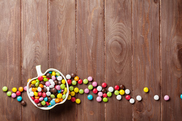 Obraz na płótnie Canvas Colorful candies over wood