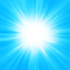 Sun on blue sky with lenses flare